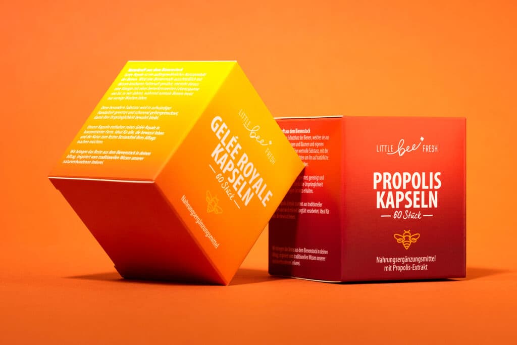 Two colorful cardboard boxes for Little Bee Fresh supplements